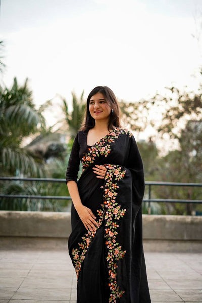Exquisite Thread and Sequin Embroidery Adorns the C Pallu of this Black Saree