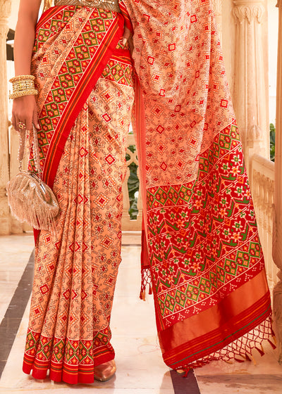 Add a Touch of Grace and Elegance to Your Wardrobe with the Apricot Pink Printed Patola Tussar Silk Saree