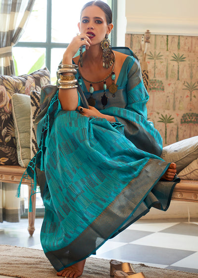 Unleash Your Inner Glamour with the Teal Blue Organza Saree