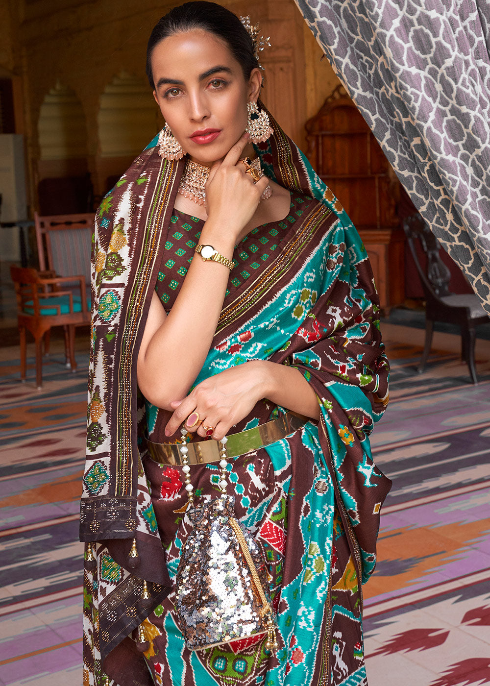 Elegance Personified: Blue & Brown Printed Patola Silk Saree with Zari Border