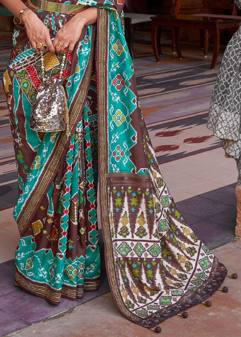 Elegance Personified: Blue & Brown Printed Patola Silk Saree with Zari Border