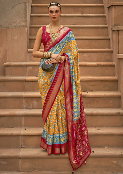 Bask in the Radiant Charm of the Pastel Yellow Woven Patola Silk Saree"
