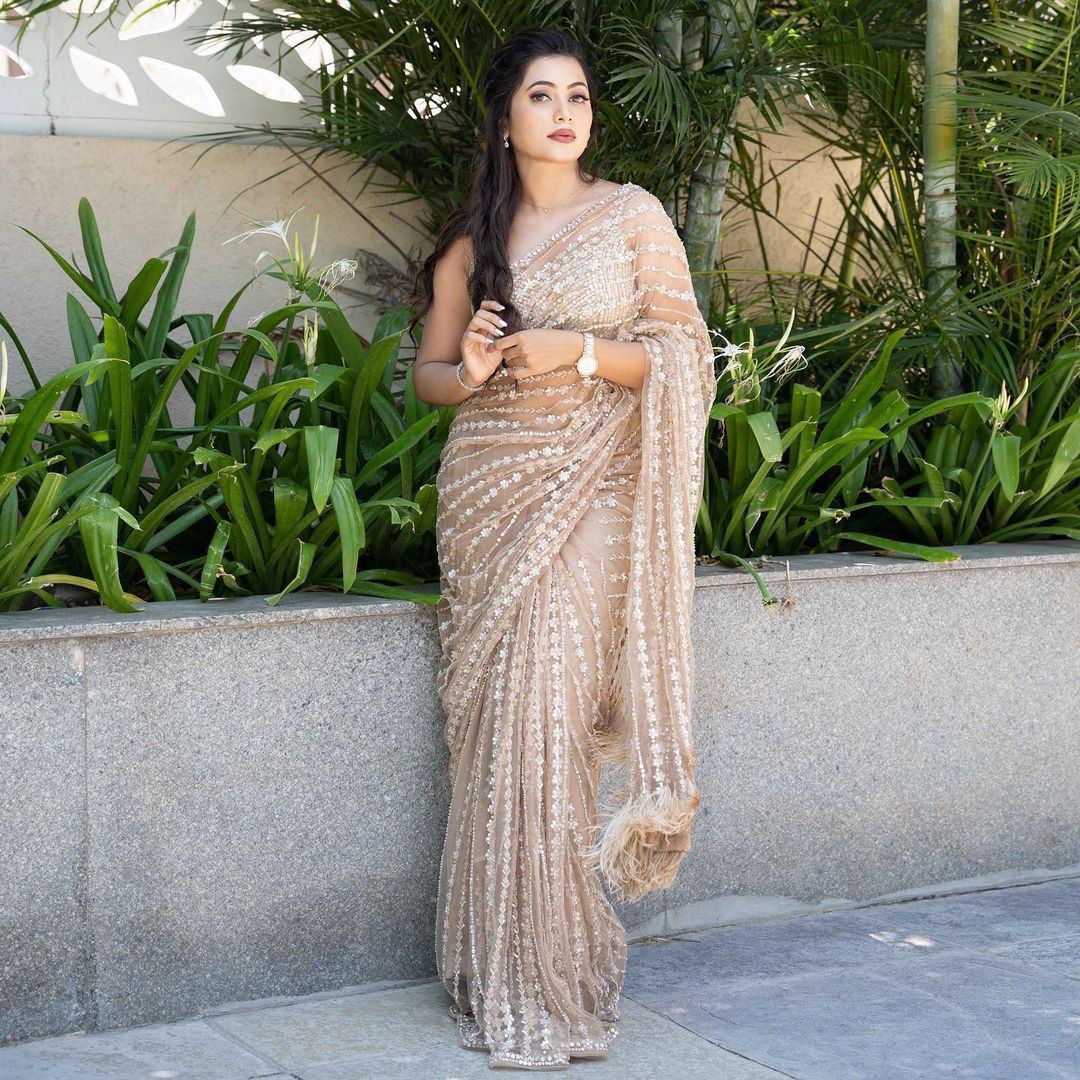 Enchanting Cream Elegance A Shimmering Sequins Saree