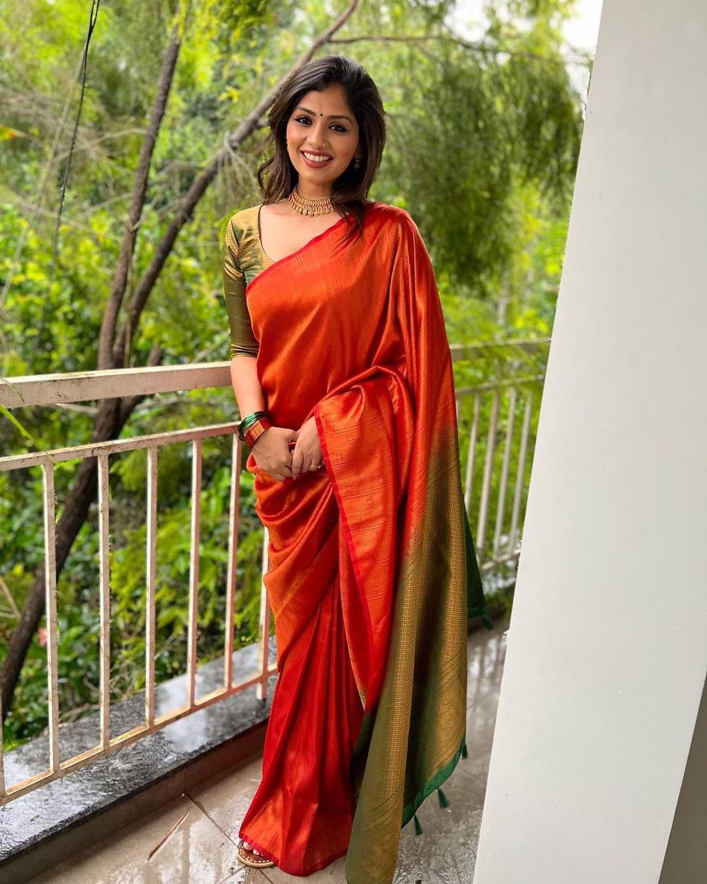 STUNNING ORANGE SAREE WITH DARK GREEN BORDER AND BLOUSE