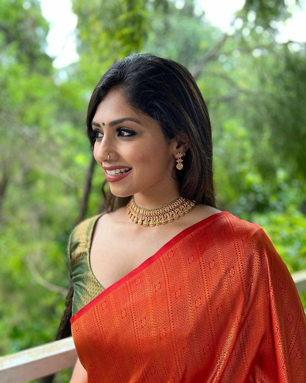 STUNNING ORANGE SAREE WITH DARK GREEN BORDER AND BLOUSE