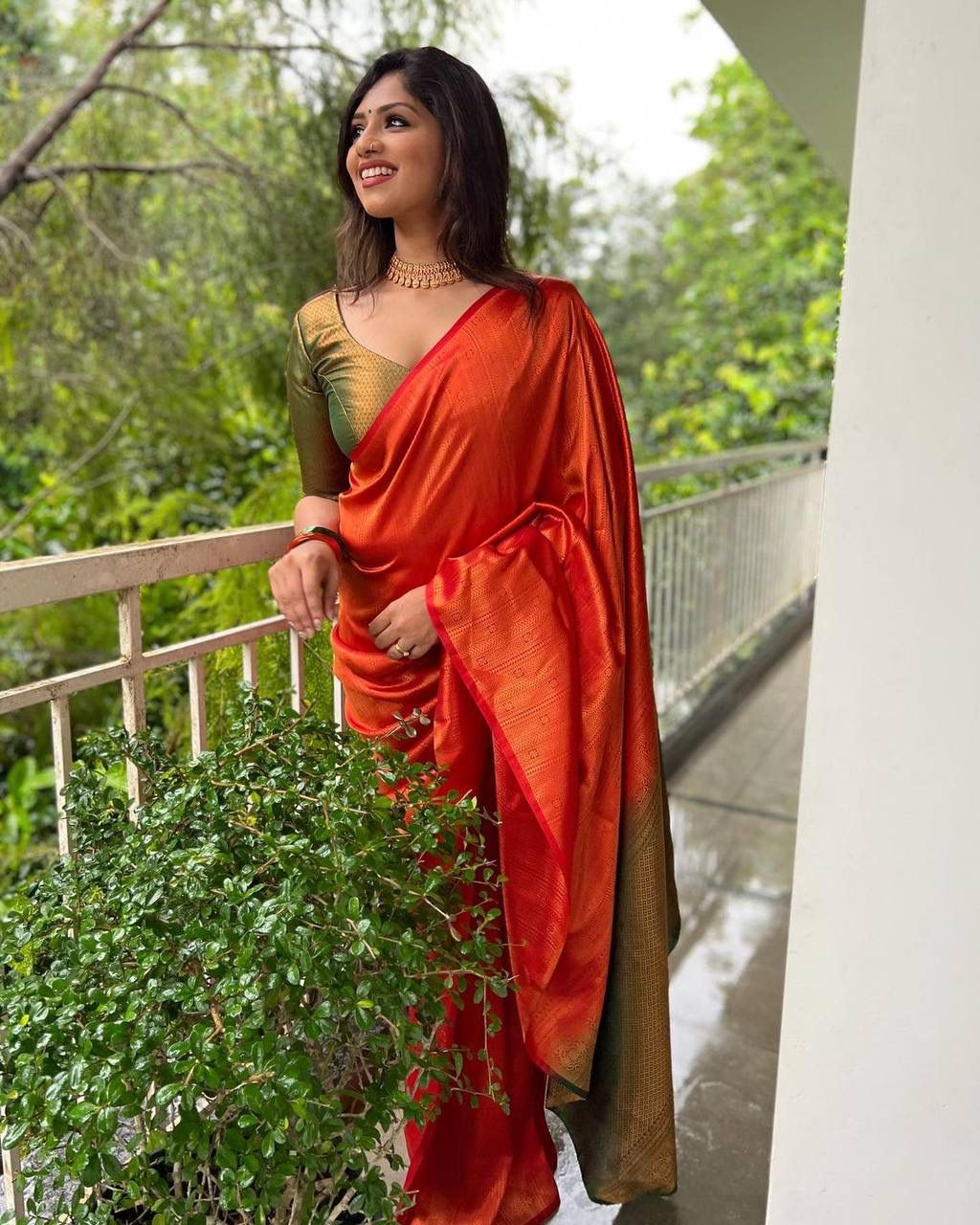 STUNNING ORANGE SAREE WITH DARK GREEN BORDER AND BLOUSE