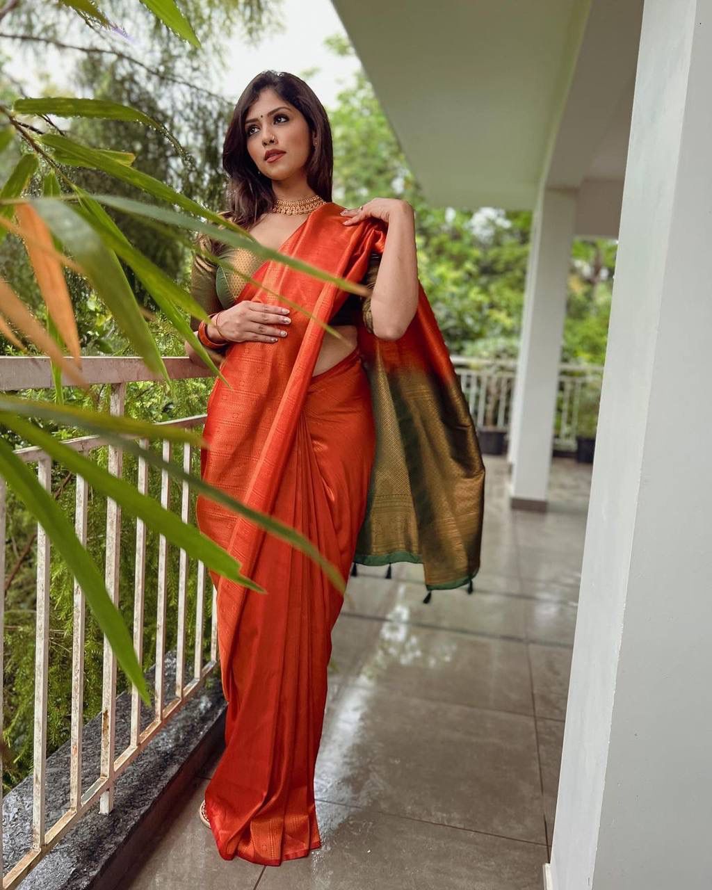 STUNNING ORANGE SAREE WITH DARK GREEN BORDER AND BLOUSE