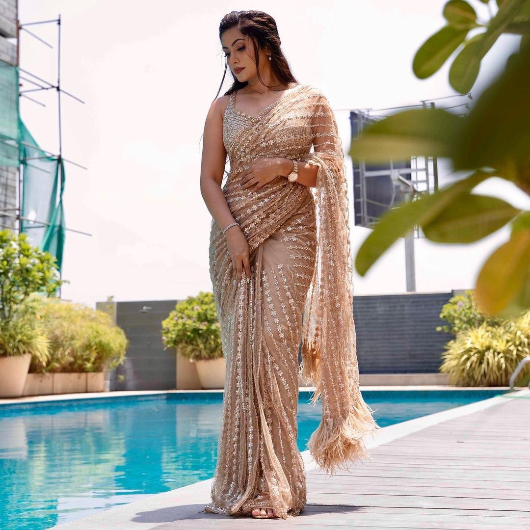 Enchanting Cream Elegance A Shimmering Sequins Saree