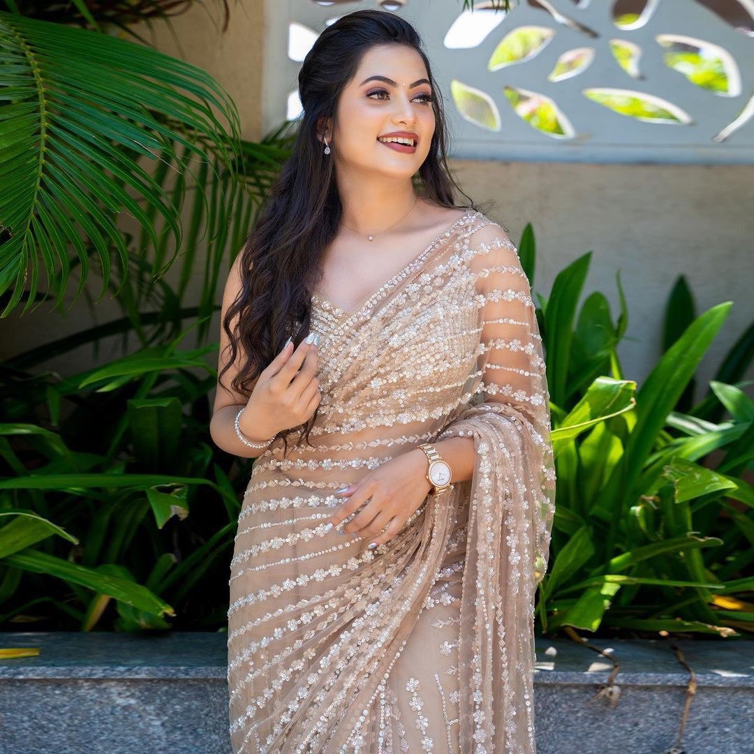 Enchanting Cream Elegance A Shimmering Sequins Saree