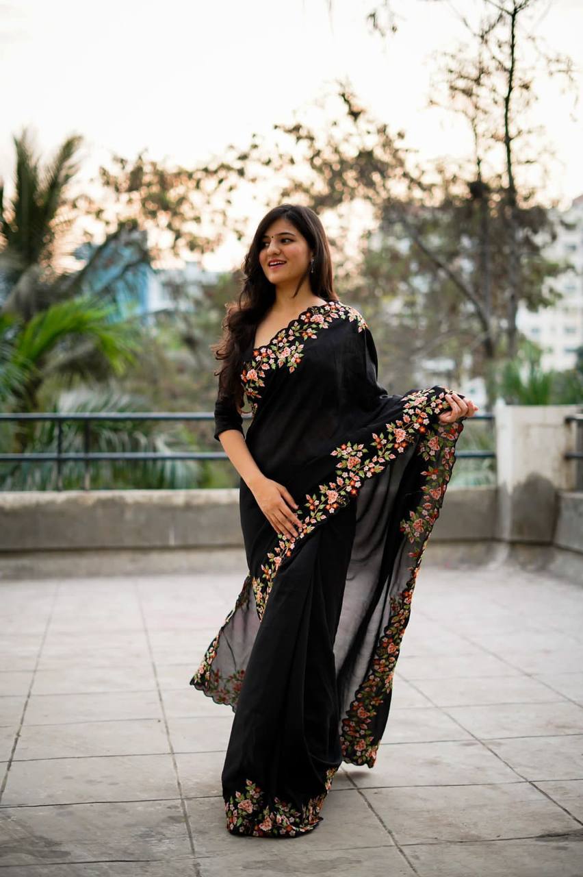 Exquisite Thread and Sequin Embroidery Adorns the C Pallu of this Black Saree