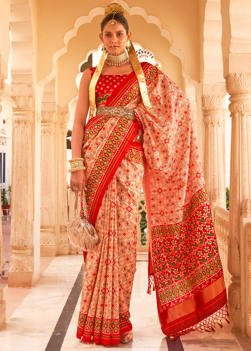 Add a Touch of Grace and Elegance to Your Wardrobe with the Apricot Pink Printed Patola Tussar Silk Saree