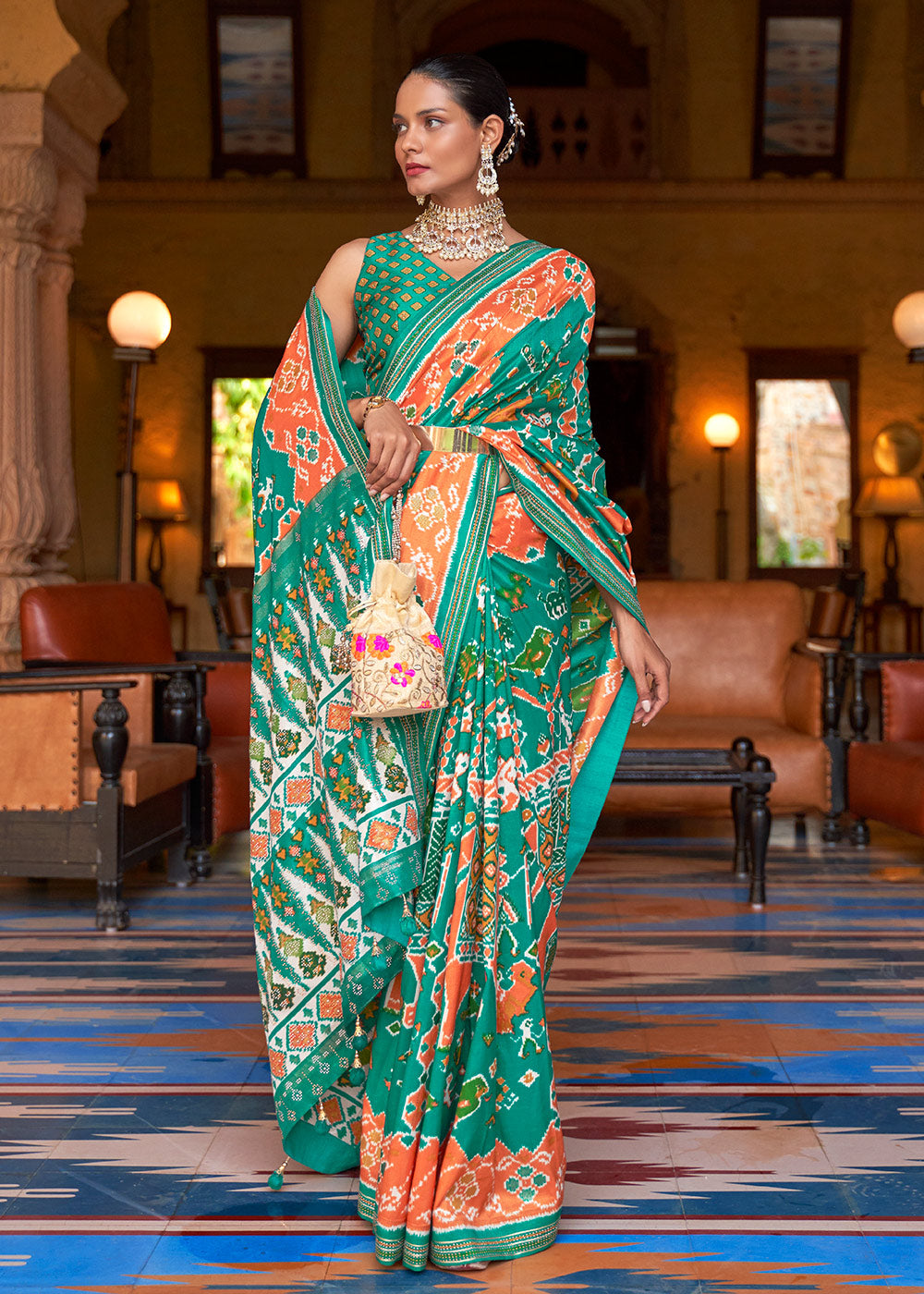 Vibrant Splendor: Green & Orange Printed Patola Silk Saree with Zari Border