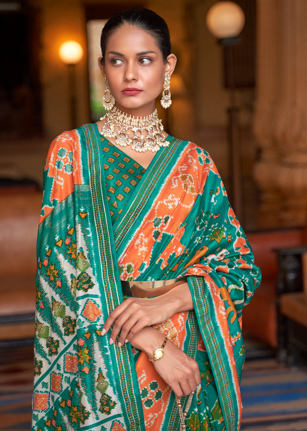 Vibrant Splendor: Green & Orange Printed Patola Silk Saree with Zari Border