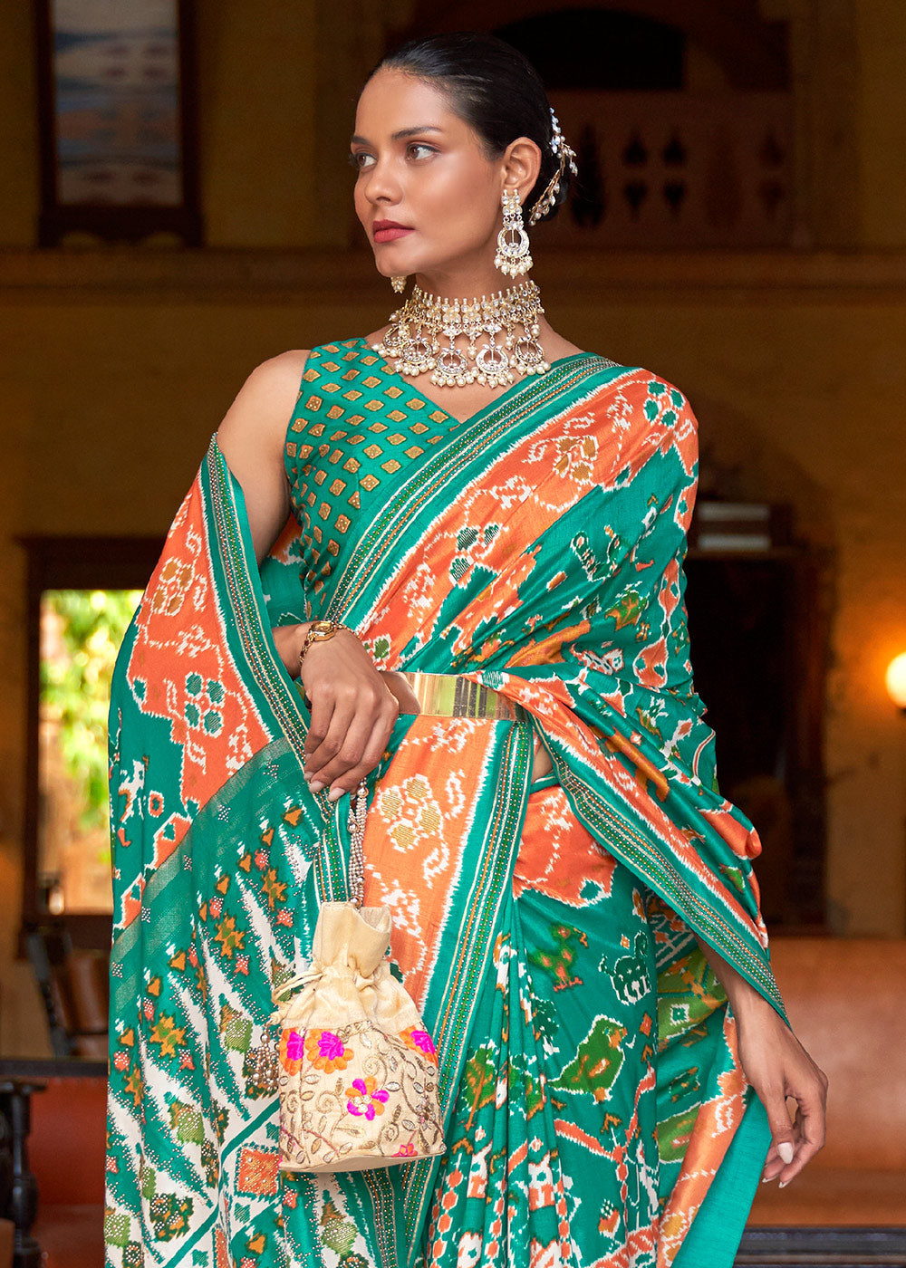 Vibrant Splendor: Green & Orange Printed Patola Silk Saree with Zari Border