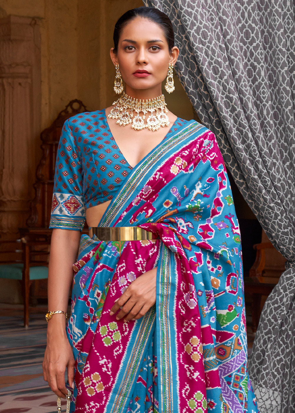 Enchanting Opulence: Blue & Pink Printed Patola Silk Saree with Zari Border