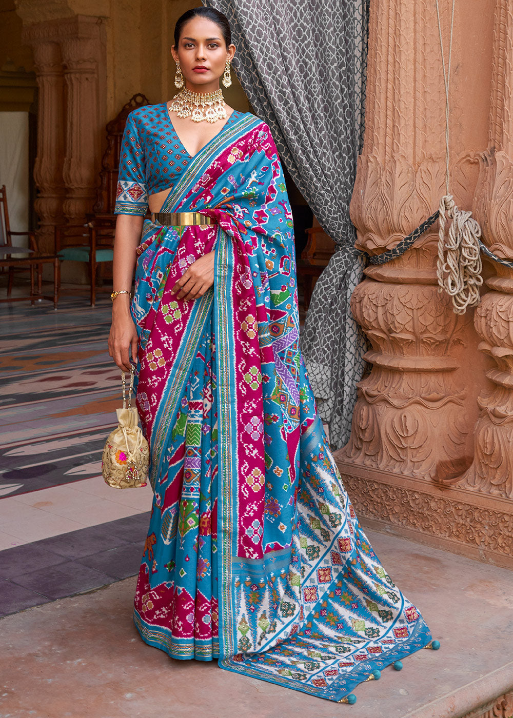 Enchanting Opulence: Blue & Pink Printed Patola Silk Saree with Zari Border