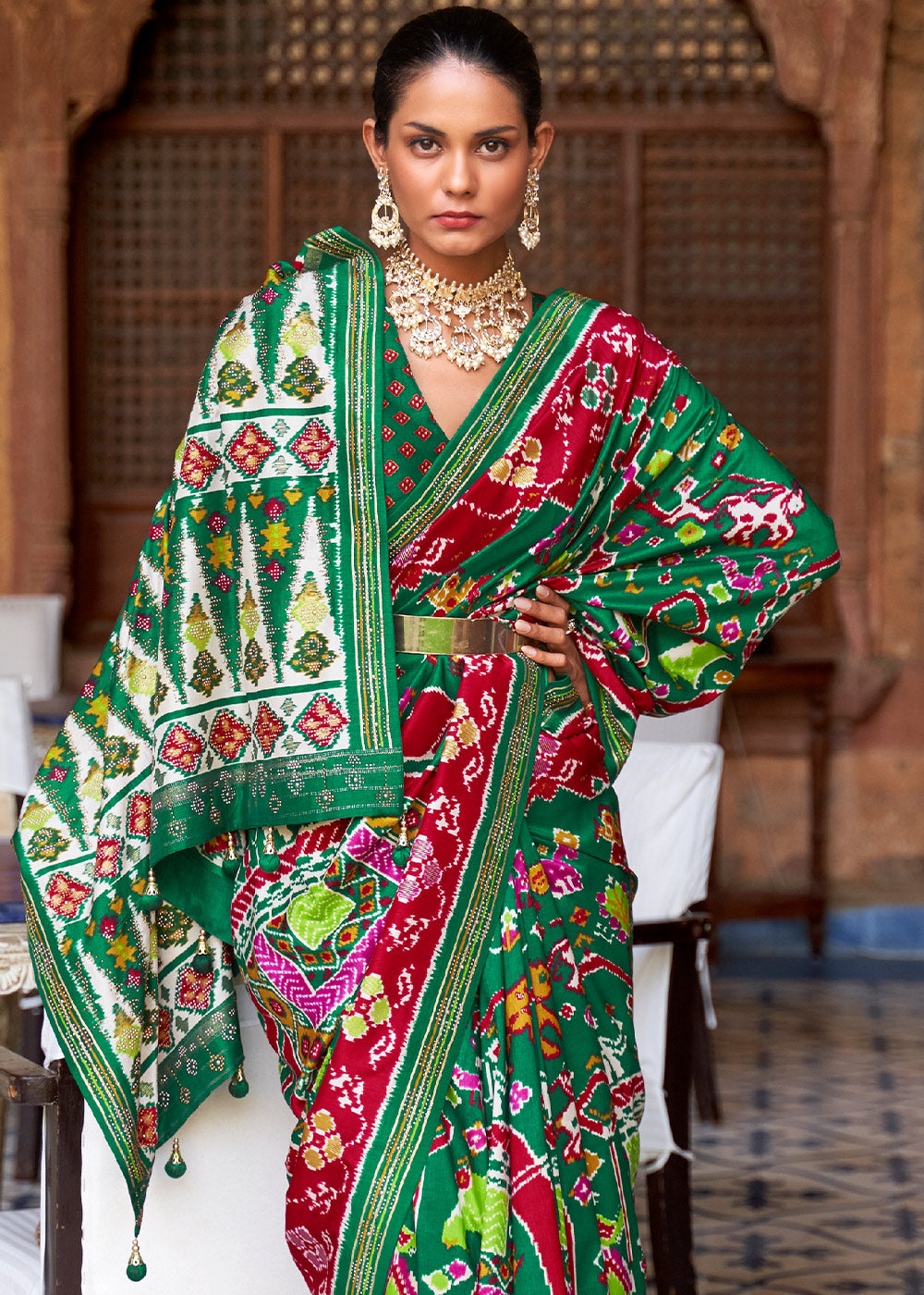 Serenade of the Forest: Green Printed Patola Silk Saree with Zari Border