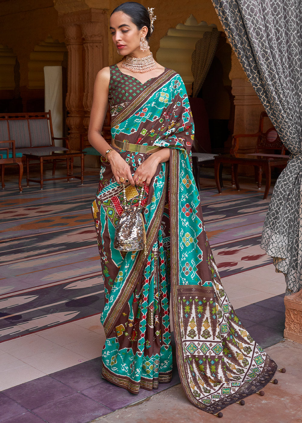 Elegance Personified: Blue & Brown Printed Patola Silk Saree with Zari Border