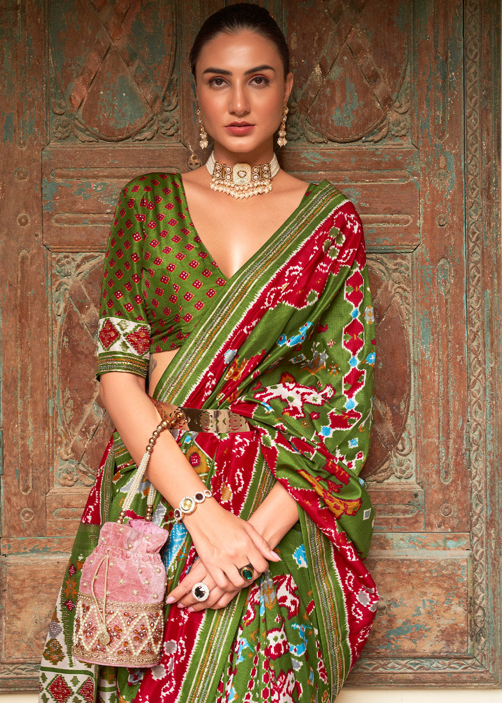 Radiant Rhythms:  Green Printed Patola Silk Saree with Zari Border