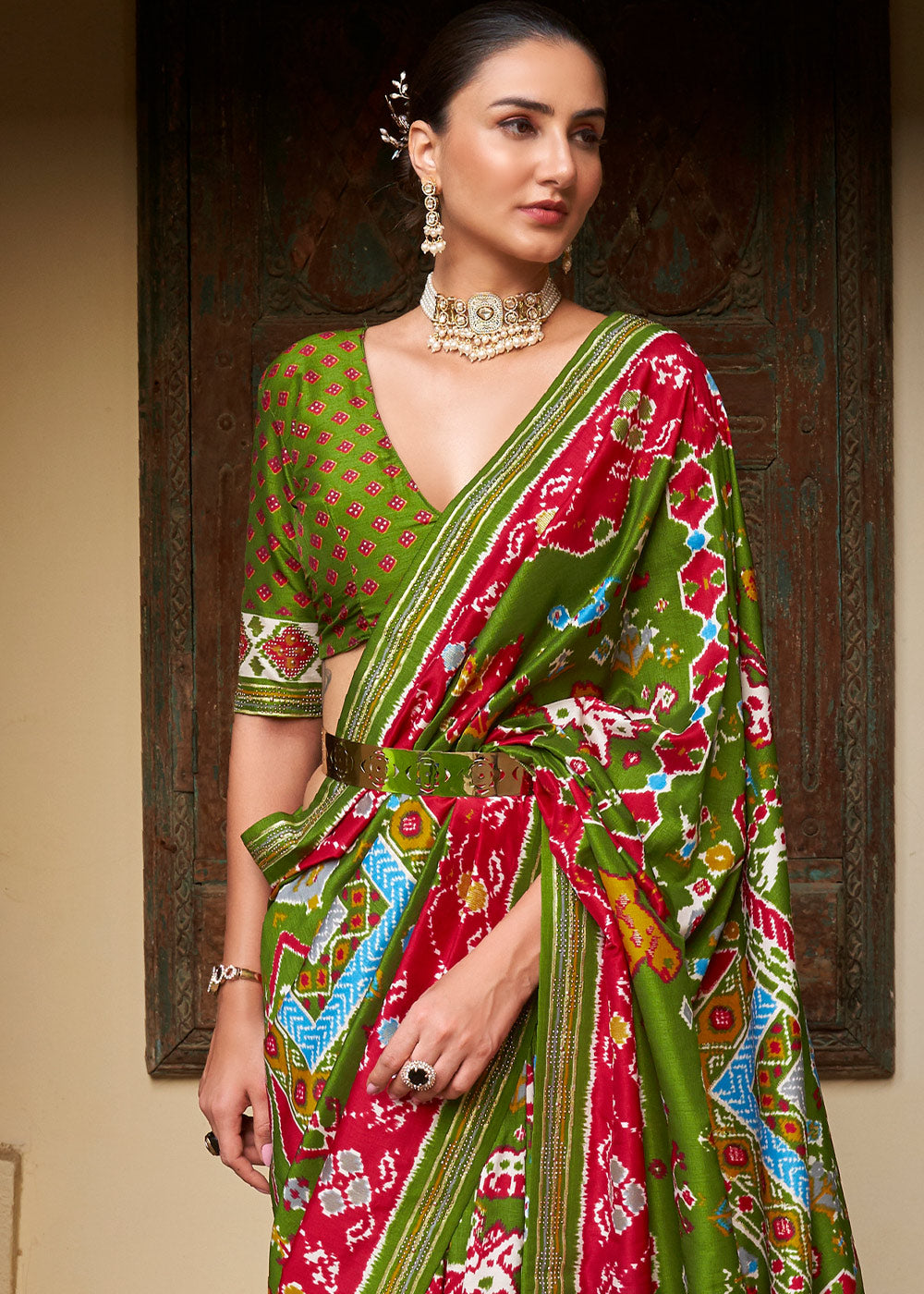 Radiant Rhythms:  Green Printed Patola Silk Saree with Zari Border