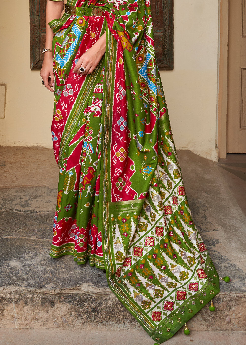 Radiant Rhythms:  Green Printed Patola Silk Saree with Zari Border