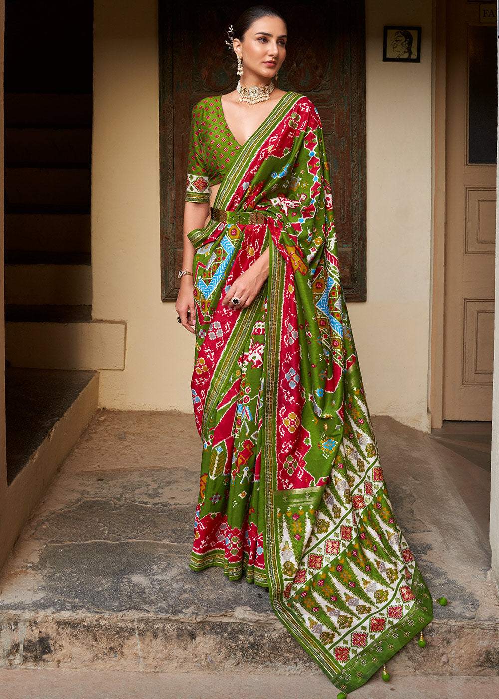 Radiant Rhythms:  Green Printed Patola Silk Saree with Zari Border