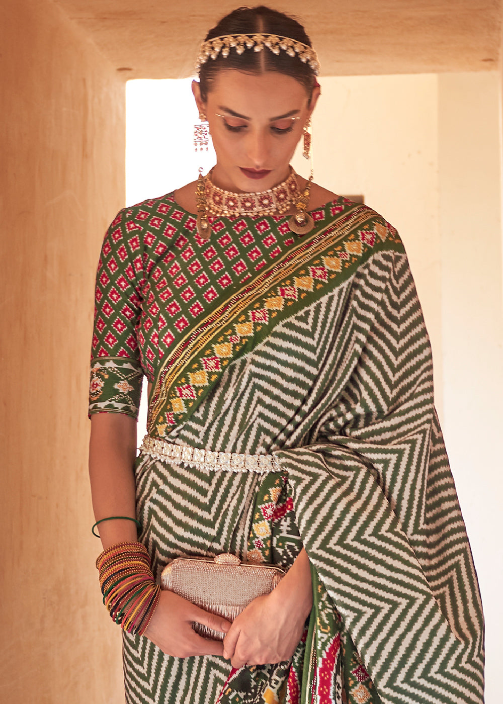 Enchanting Deep Green Off-White Patola Silk Saree