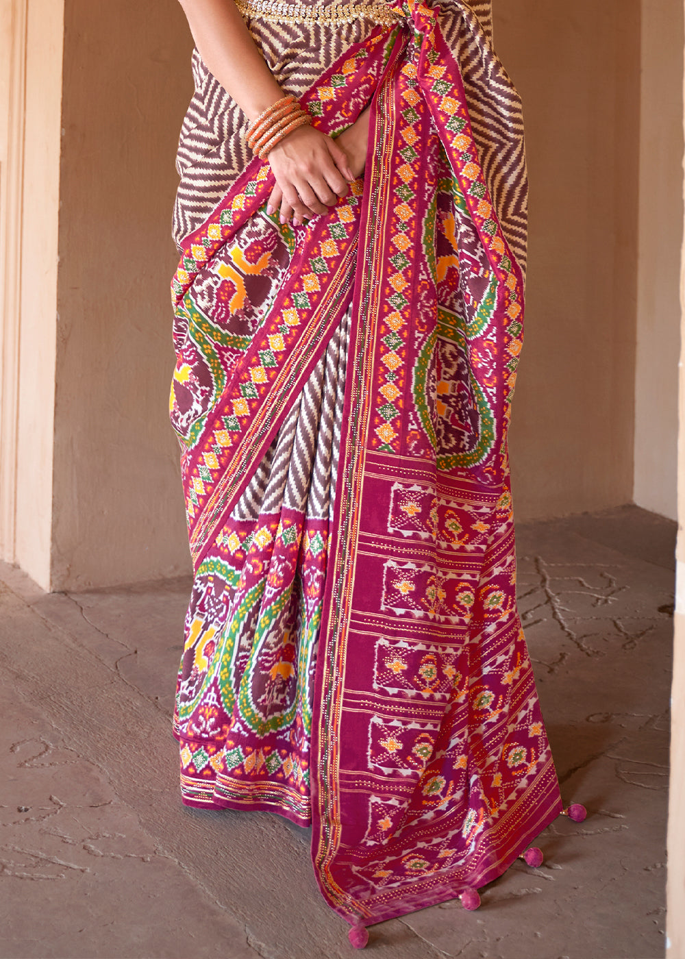 Rustic Elegance: Brown & Pink Printed Patola Silk Saree with Zari Border