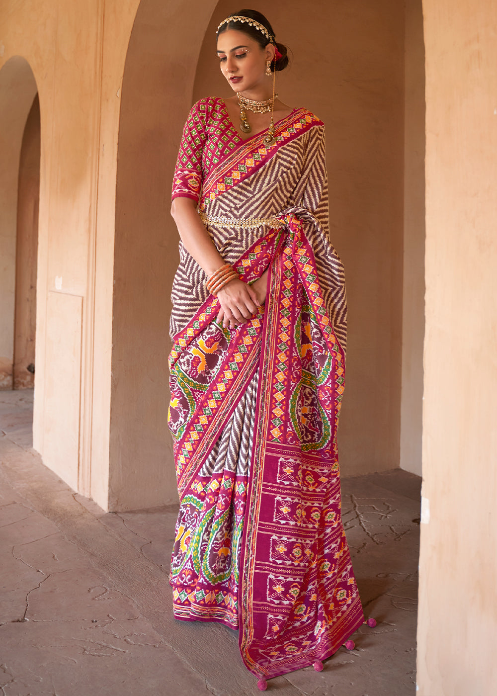 Fuchsia Glamour: Oscar Pink Off-White Patola Silk Saree with Zari Weave and Embroidery