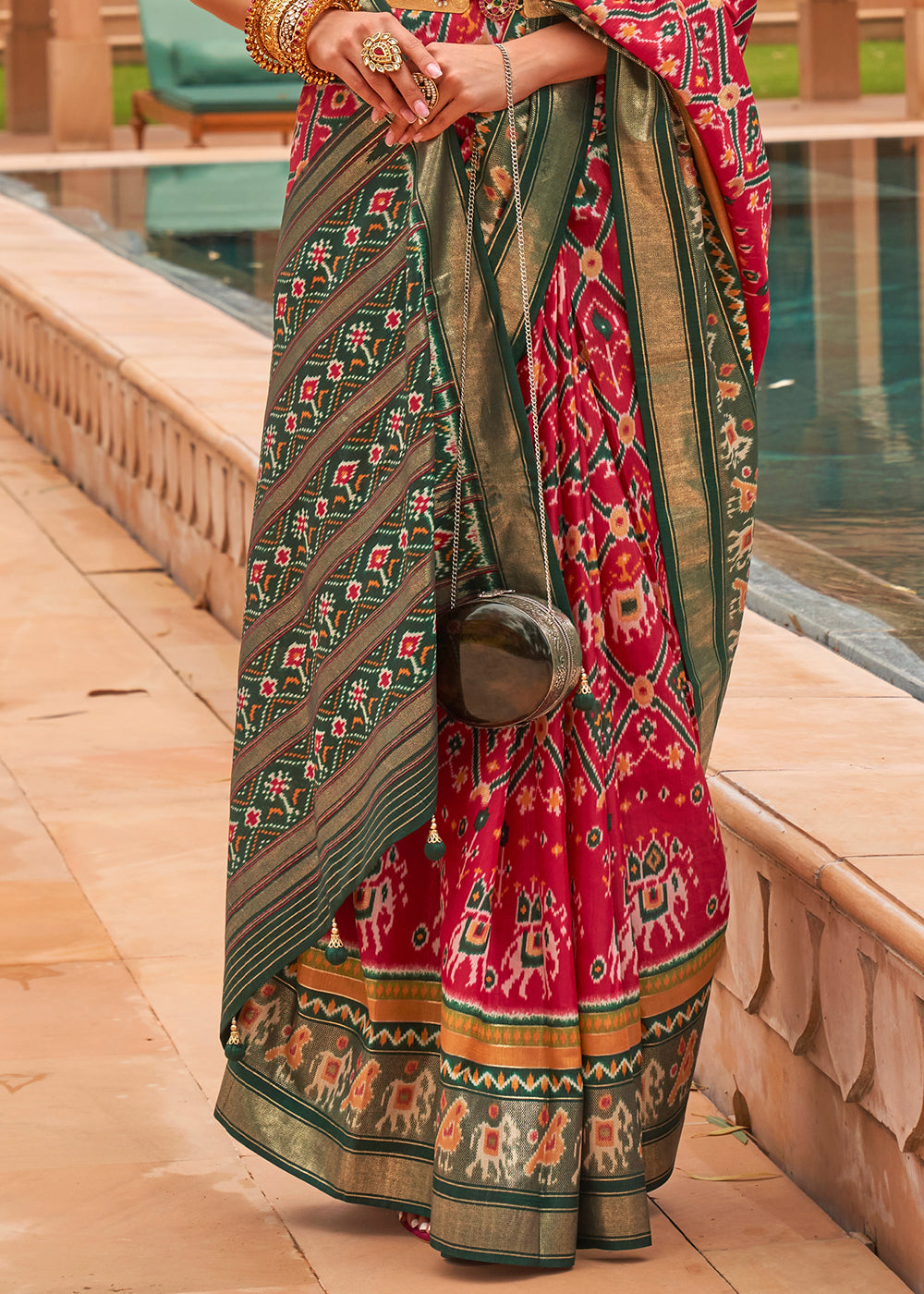 Graceful Pink Patola: A Woven Silk Saree for Timeless Beauty