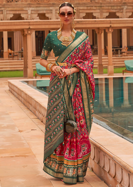 Graceful Pink Patola: A Woven Silk Saree for Timeless Beauty