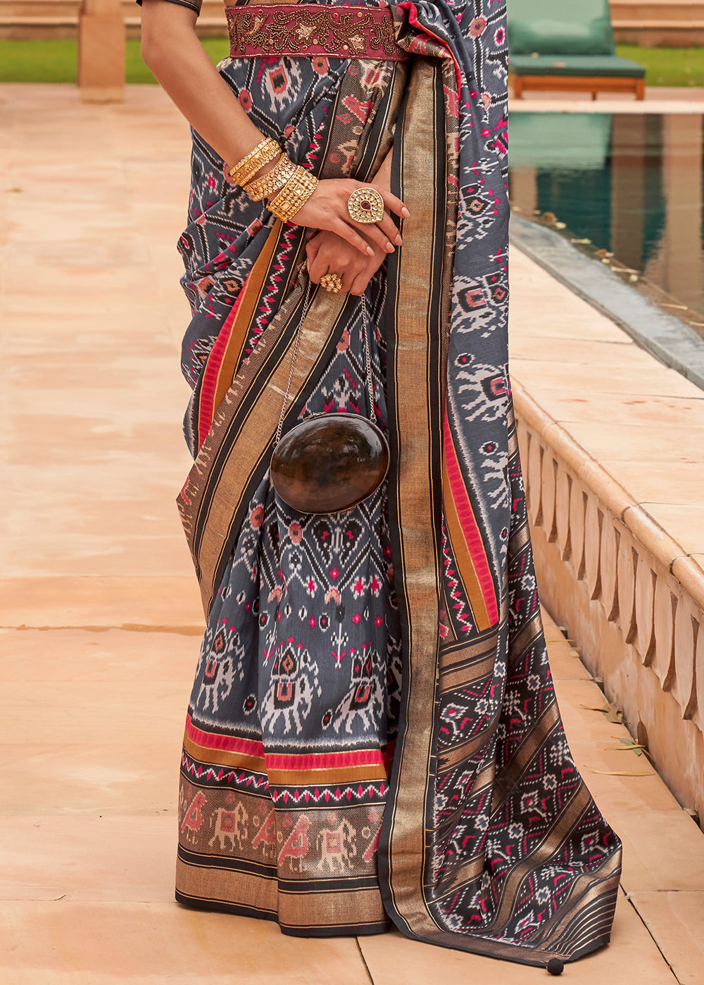 Elegant Charcoal Patola: A Woven Silk Saree for Sophisticated Style