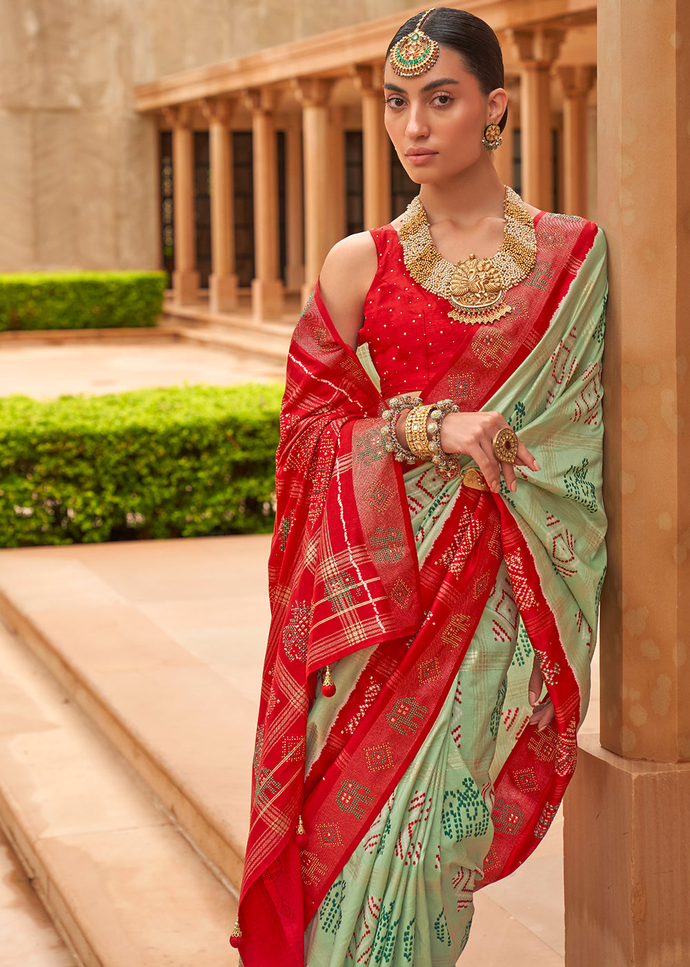 The Striking Contrasts of Green and Red in Patola Saree