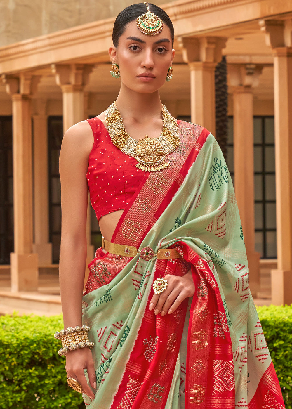 The Striking Contrasts of Green and Red in Patola Saree