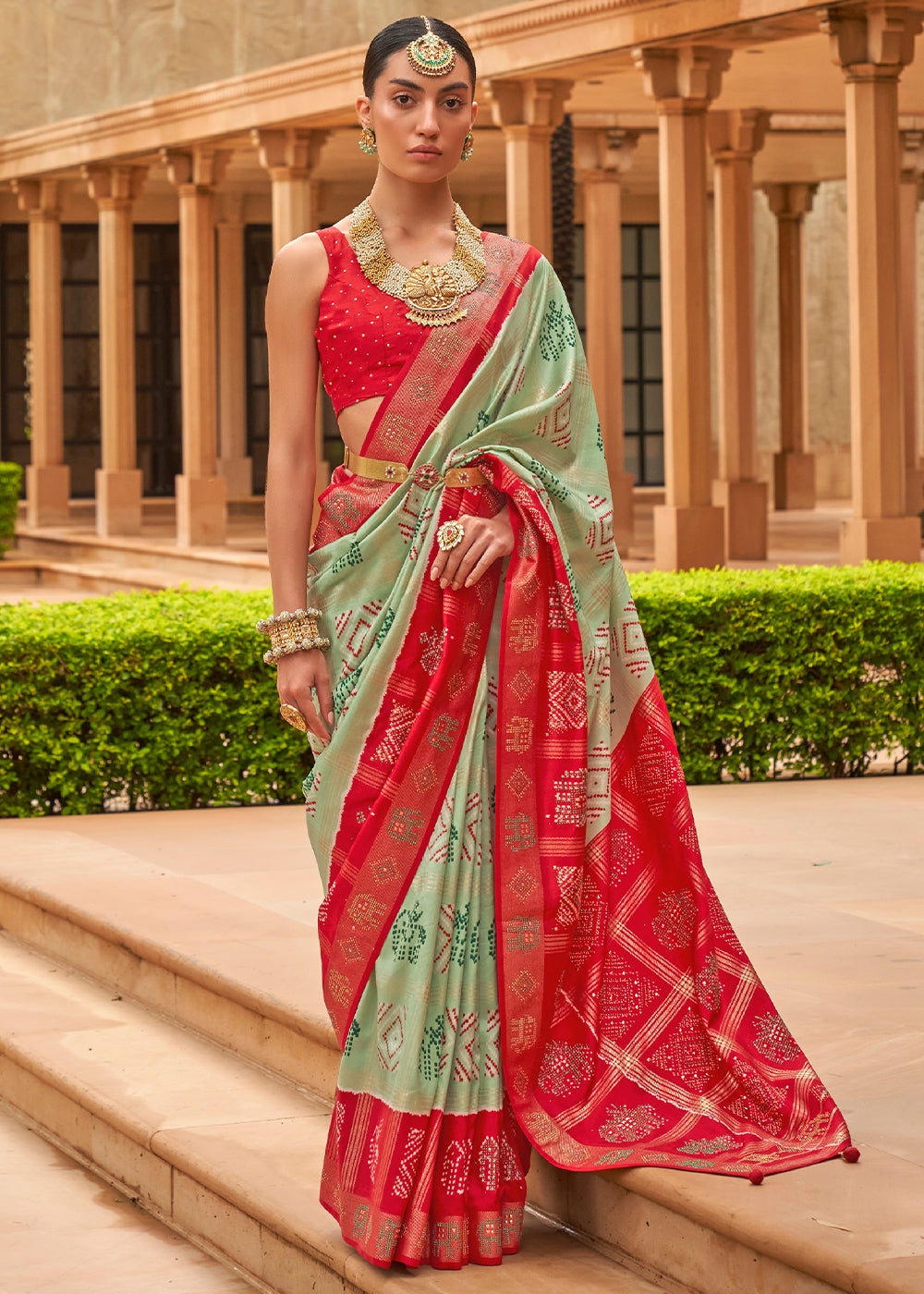 The Striking Contrasts of Green and Red in Patola Saree