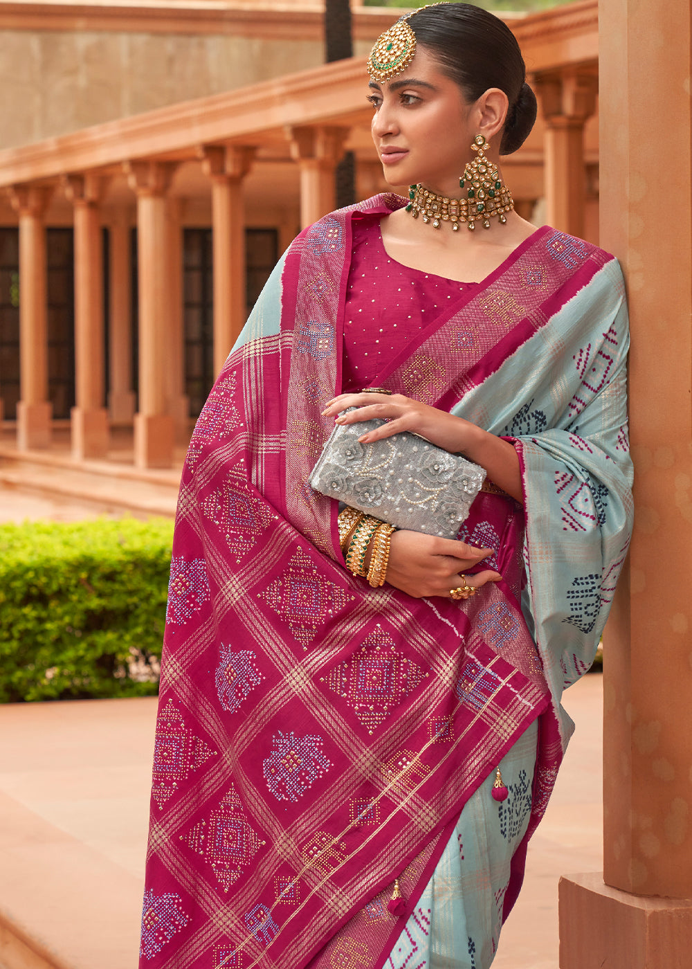 The Regal Elegance of Dark Rani and Sky Blue Patola Saree