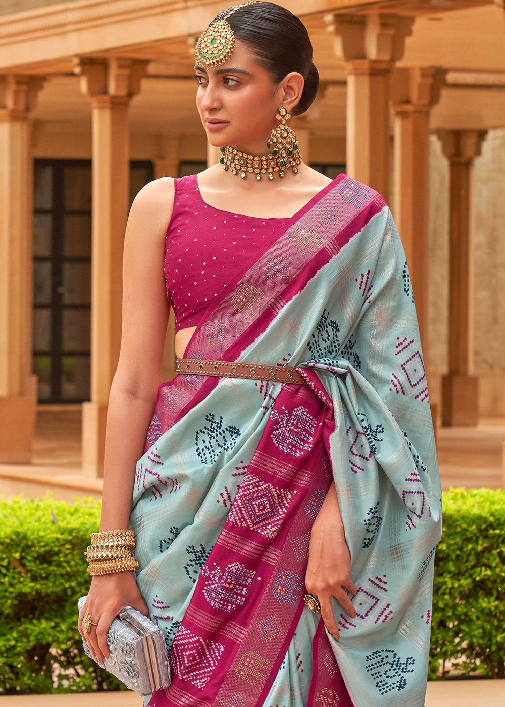 The Regal Elegance of Dark Rani and Sky Blue Patola Saree