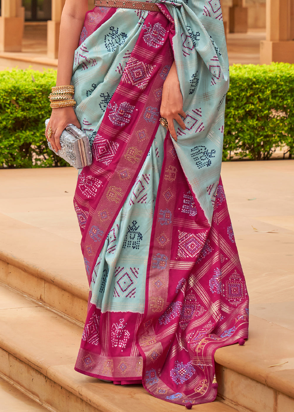 The Regal Elegance of Dark Rani and Sky Blue Patola Saree