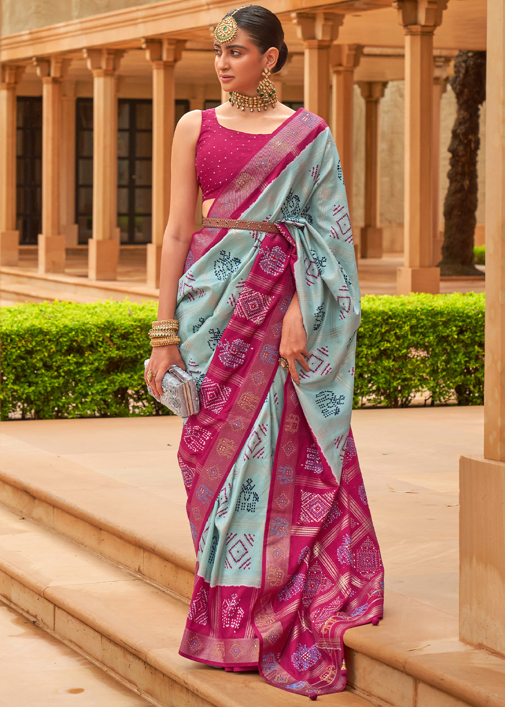 The Regal Elegance of Dark Rani and Sky Blue Patola Saree