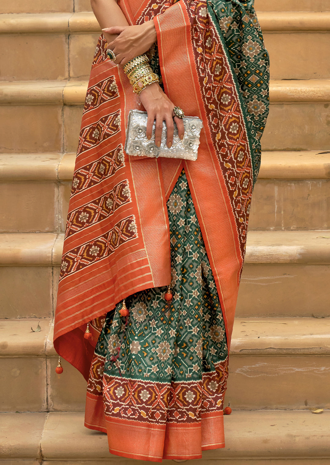 Vibrant Tea Green and Orange Woven Patola Silk Saree for a Playful Look