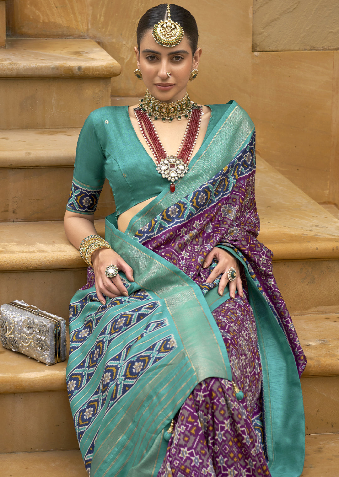 Embrace Royalty with the Cadbury Purple Woven Patola Silk Saree