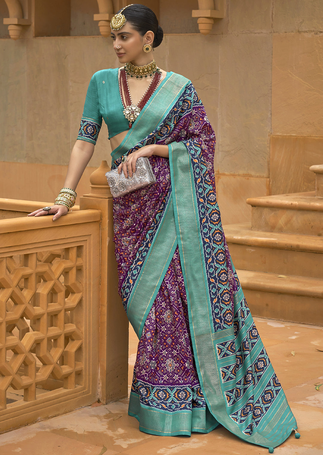 Embrace Royalty with the Cadbury Purple Woven Patola Silk Saree