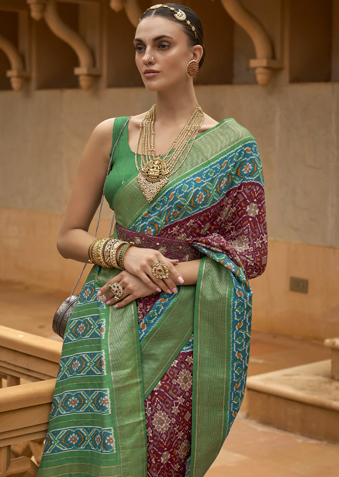 Captivate Hearts with the Cherry Red Woven Patola Silk Saree