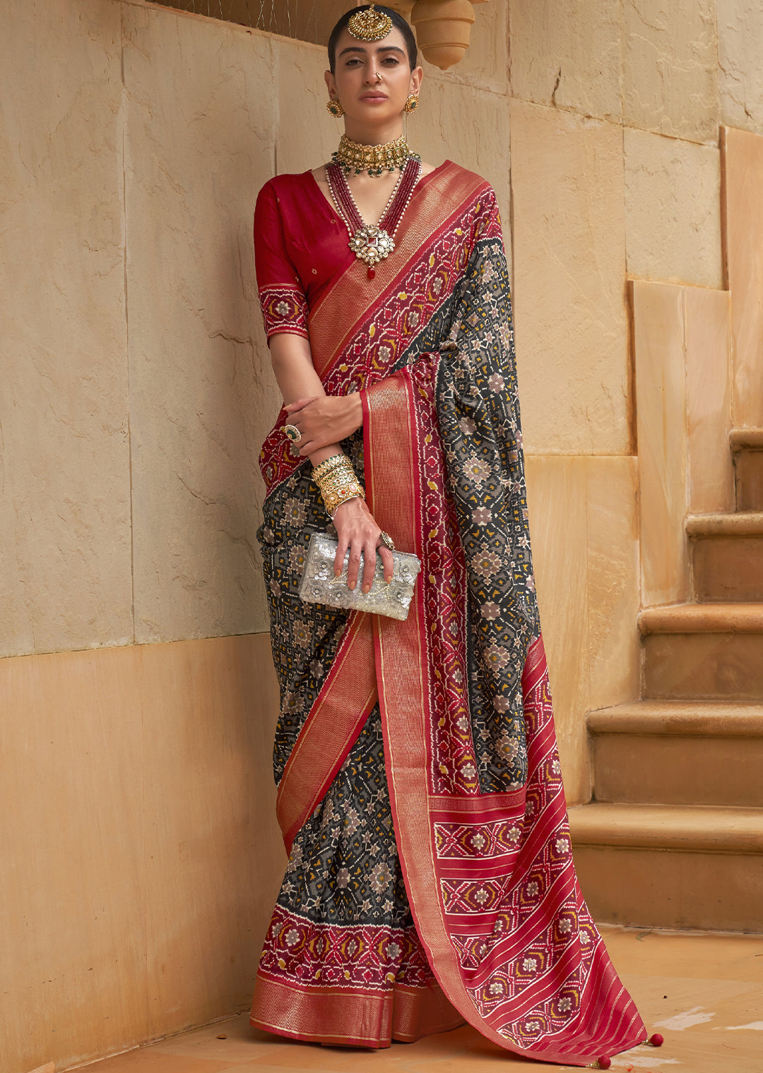 Unleash the Magic of the Night with the Metallic Black Woven Patola Silk Saree