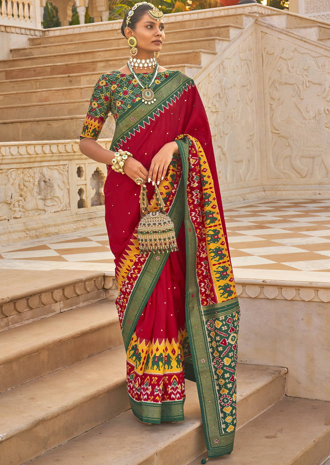 Radiate Graceful Elegance with the Rose Red Woven Patola Silk Saree"