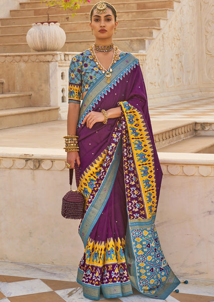 Exude Regal Beauty with the Plum Purple Woven Patola Silk Saree