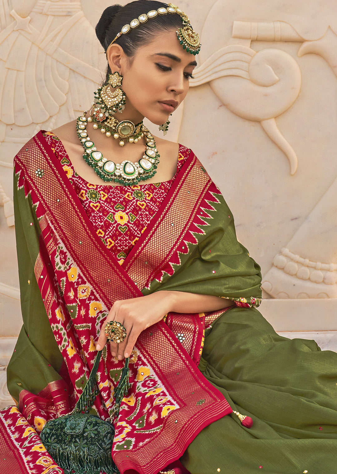 Unleash your Bold Side with the Hunter Green Woven Patola Silk Saree