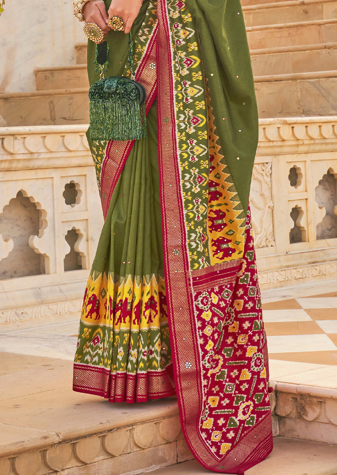 Unleash your Bold Side with the Hunter Green Woven Patola Silk Saree