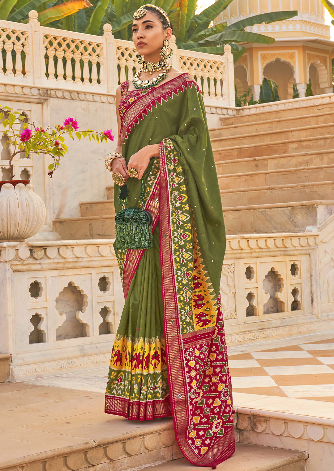 Unleash your Bold Side with the Hunter Green Woven Patola Silk Saree